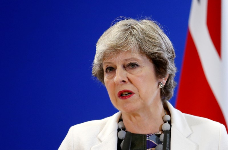 Britain's PM May addresses a news conference during EU leaders summit in Brussels