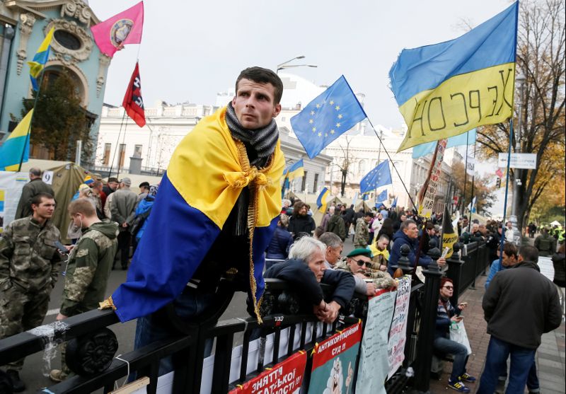 An opposition protester is seen in a tent camp set up near the Ukrainian parliament building in Kiev