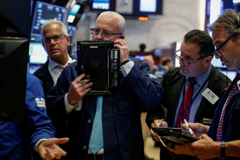 Wall Street slips as banks fall after results, AT&T sinks