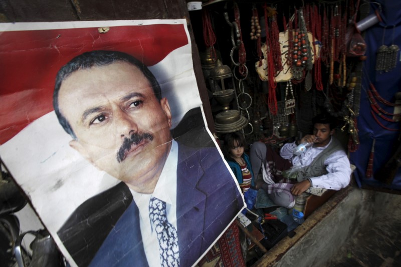 A poster of Saleh is seen on a door of a shop in an old quarter of Yemen's capital Sanaa