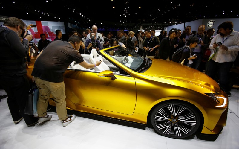 FILE PHOTO: People look at a Lexus LF-C2 concept vehicle on display during the model's world debut at the Los Angeles Auto Show