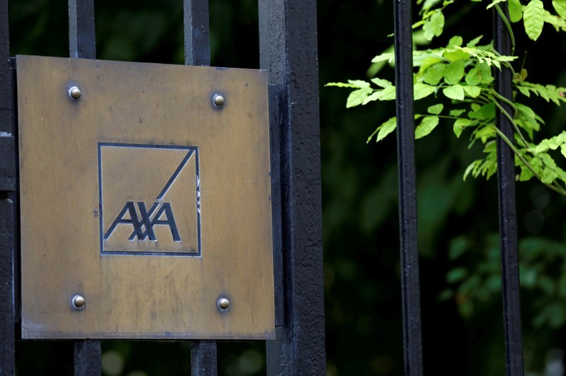 FILE PHOTO: Logo of France's biggest insurer Axa is seen in front the compagny headquarter in Paris