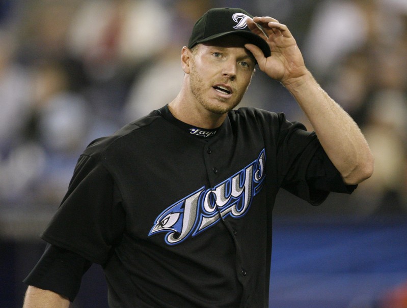 Toronto Blue Jays pitcher Halladay adjusts his cap against the Chicago White Sox in Toronto