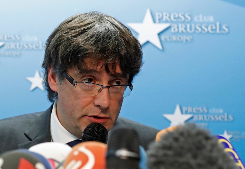 Sacked Catalan leader Carles Puigdemont attends a news conference in Brussels