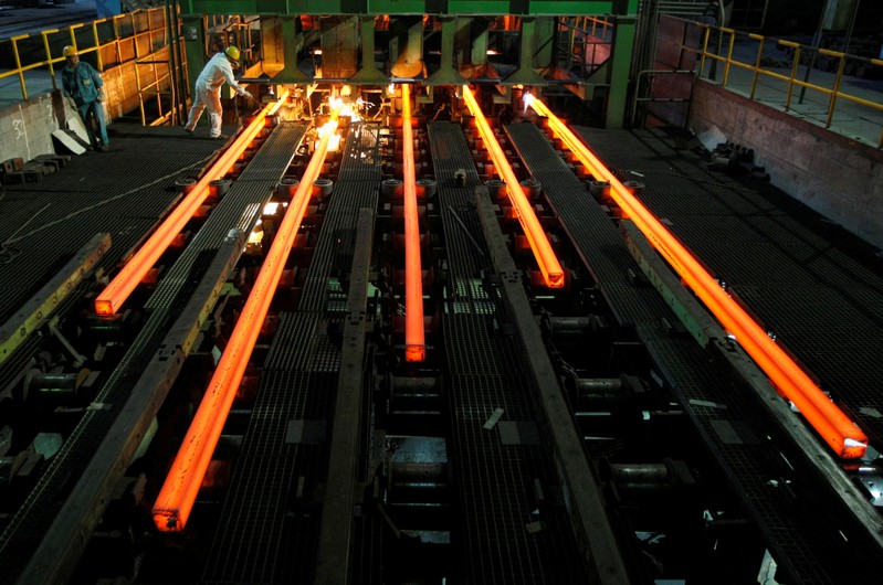 FILE PHOTO: Employees work at a workshop of Hangzhou Iron and Steel Group Company in Hangzhou