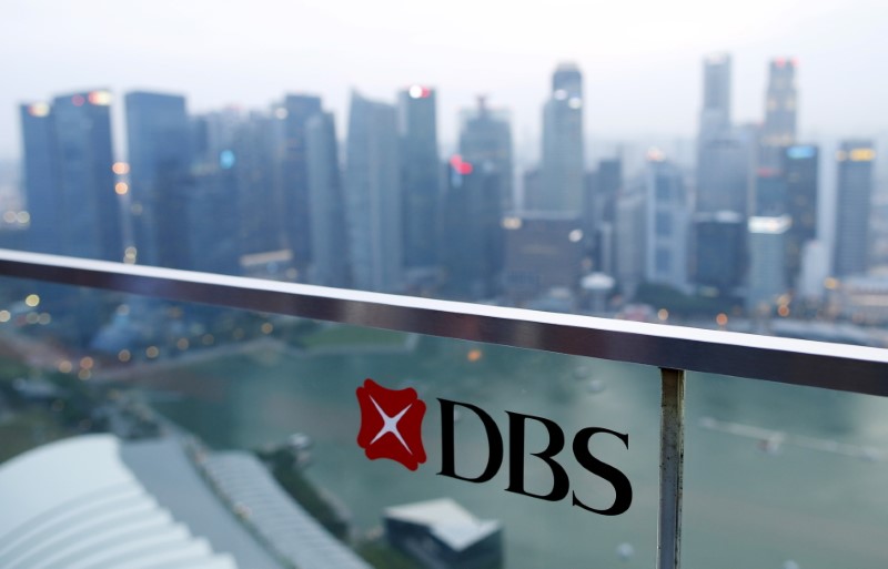 A DBS logo in pictured in the backdrop of the central business district in Singapore