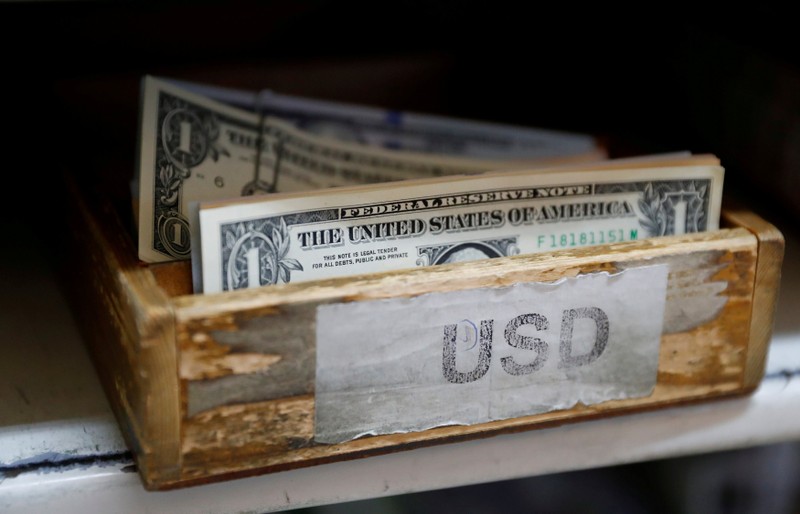 FILE PHOTO: U.S. Dollar banknotes are seen in a box at the Money Service Austria company's headquarters in Vienna