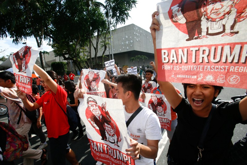 Protesters shout slogans during a protest against U.S. President Trump's visit in Manila
