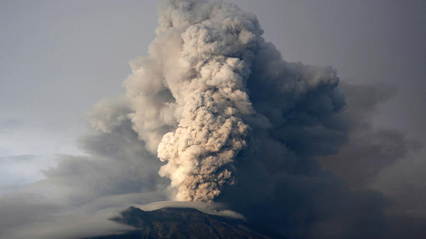 Erupting volcano spits ash over 2 miles in the sky