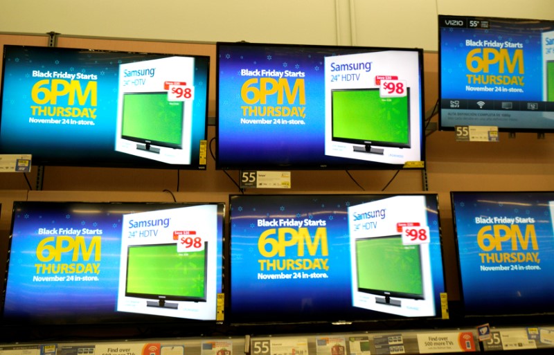 Advertisements of the upcoming Black Friday sales are seen on TV screens at a Walmart store in Westminster