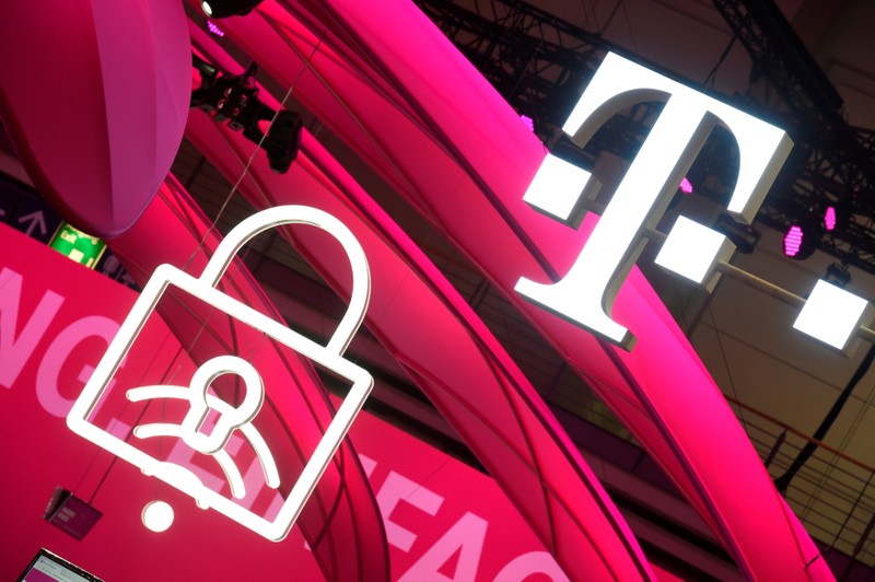 FILE PHOTO: Deutsche Telekom logo is seen during preparations at the CeBit computer fair in Hanover