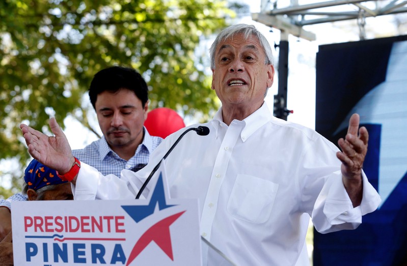 Chilean presidential candidate Sebastian Pinera speaks and takes part in a campaign rally in Santiago