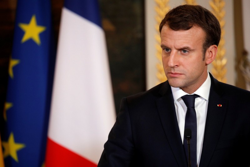 French President Emmanuel Macron attends a news conference following a meeting with Guinea's President Alpha Conde at the Elysee Palace in Paris