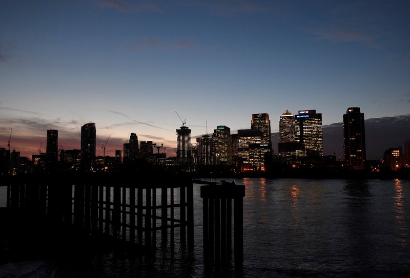 The Canary Wharf financial district is seen at dusk in London