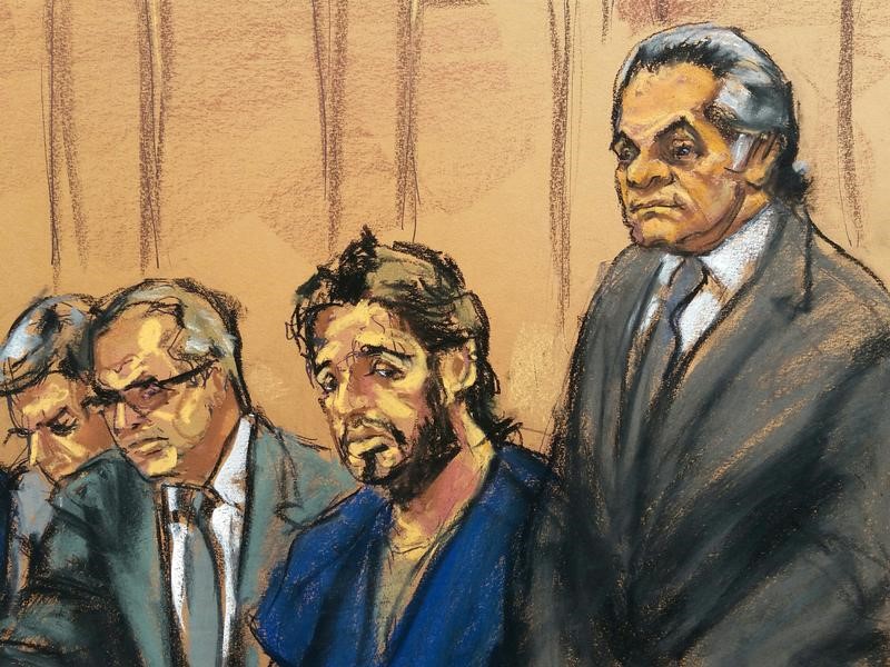 Turkish gold trader Reza Zarrab sits with lawyers Erich Ferrari, Marc Agnifilo, and Benjamin Brafman as he appears in Manhattan federal court in New York