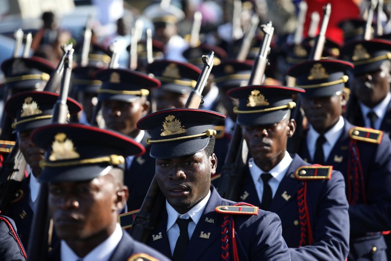 Members of the Haitian Armed Forces (FAD'H) parade in the streets of Cap-Haitien