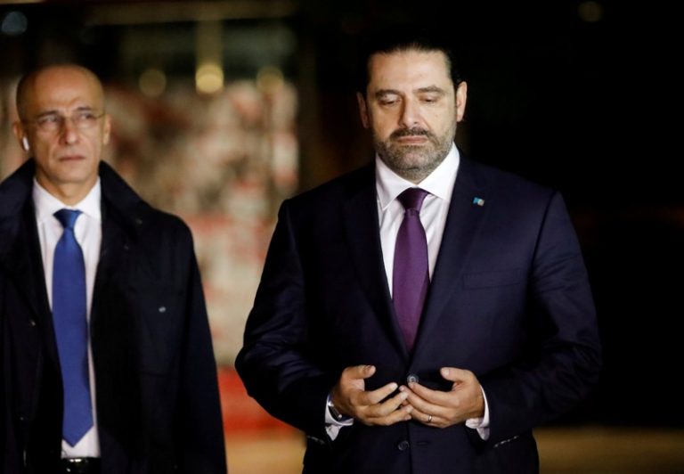 Hariri, back in Beirut, attends national day parade