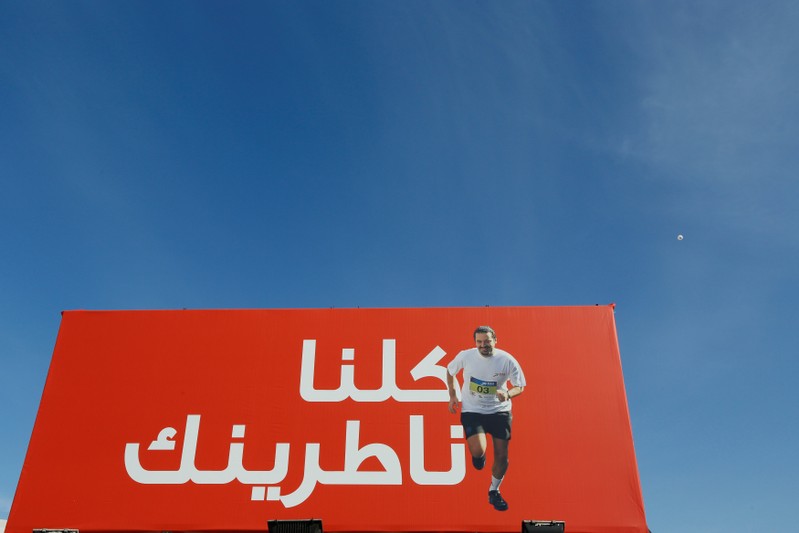 A billboard depicting Lebanon's Prime Minister Saad al-Hariri, who has resigned, is seen during the annual Beirut Marathon