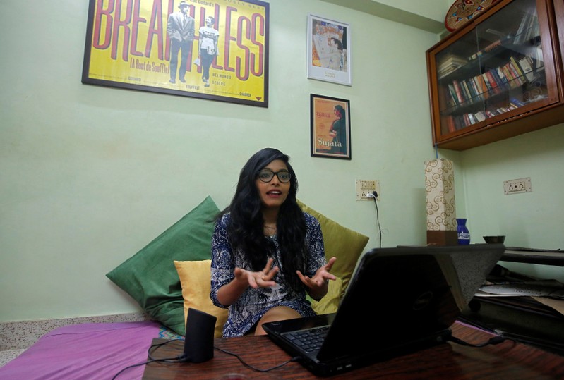 Actor Divya Unny gestures as she speaks inside her residence in Mumbai