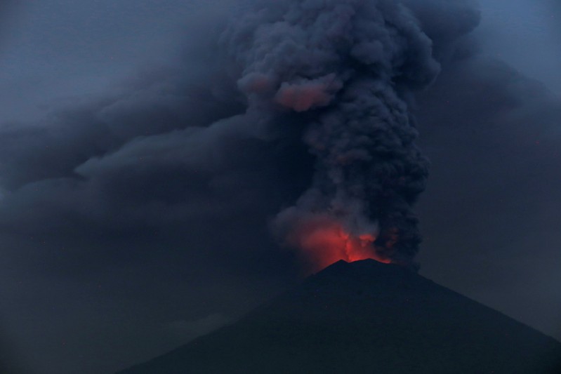 Glowing light of hot lava is seen during the eruption of Mount Agung as seen from Amed in Karangasem