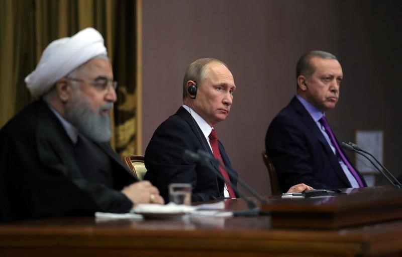 Iran's President Rouhani together with his counterparts Putin and Erdogan attend a joint news conference following their meeting in Sochi