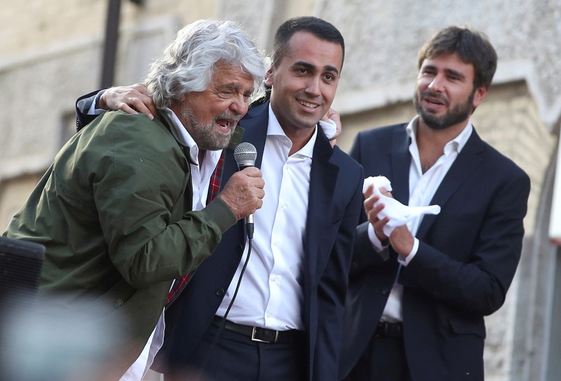 FILE PHOTO:5-Star movement members Beppe Grillo, Luigi Di Maio and Alessandro Di Battista attend a demonstration against a new electoral law in downtown Rome