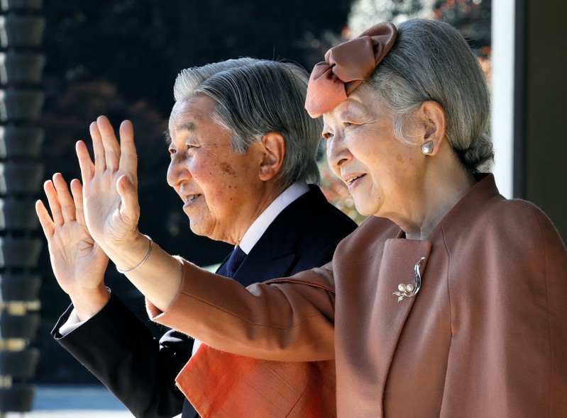 Japan's Emperor Akihito and Empress Michiko wave to Luxembourg's Grand Duke Henri after their meeting and welcoming ceremony for Grand Duke at the Imperial Palace in Tokyo