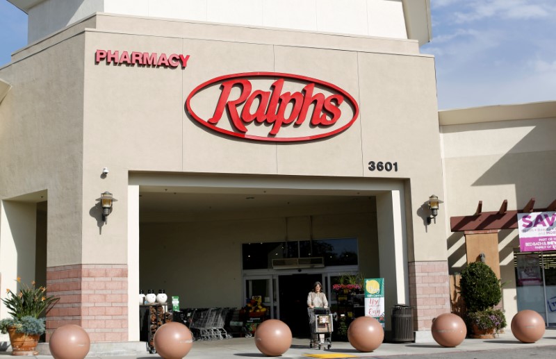 FILE PHOTO: A shopper walks out of a Ralphs grocery store, which is owned by Kroger Co, ahead of company results in Pasadena