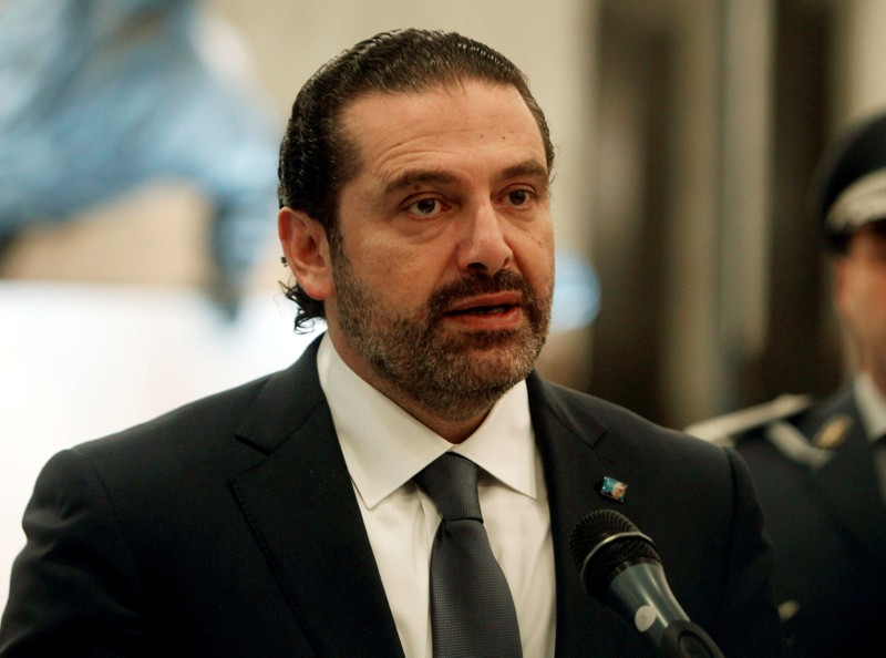 Saad al-Hariri who suspended his decision to resign as prime minister talks at the presidential palace in Baabda