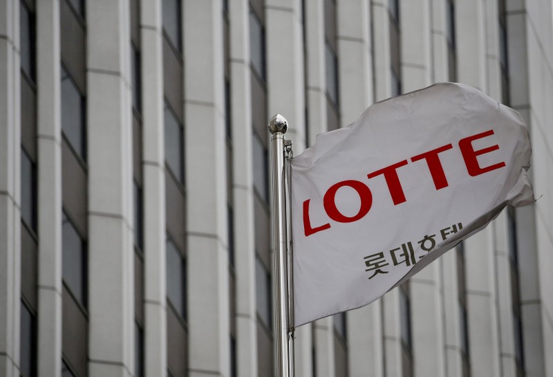 FILE PHOTO: A flag bearing the logo of Lotte Hotel flutters at a Lotte Hotel in Seoul