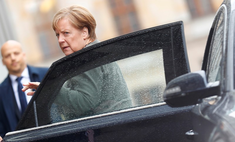 Merkel, leader of the CDU, arrives at the German Parliamentary Society offices before the start of exploratory talks about forming a new coalition government in Berlin