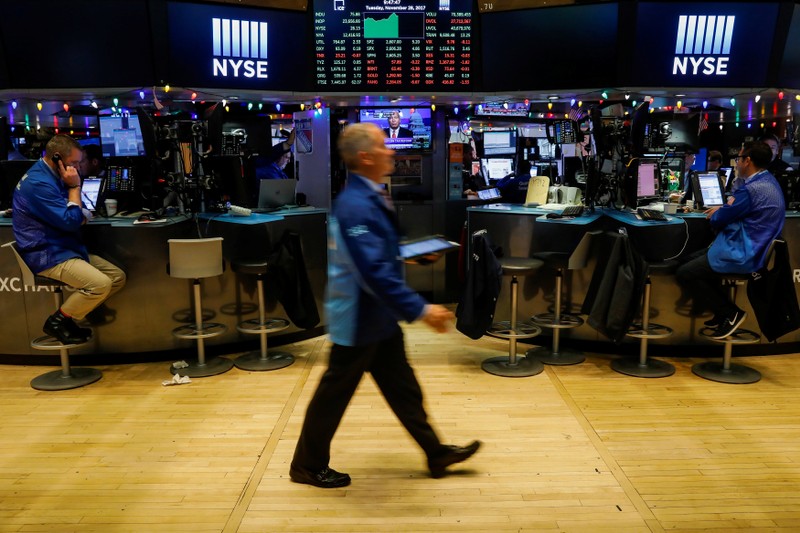 Traders work on the floor of the NYSE in New York