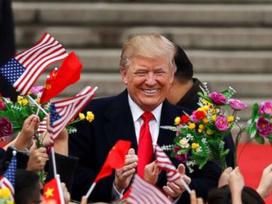 Pomp and pageantry greet Trump ahead of talks with Xi