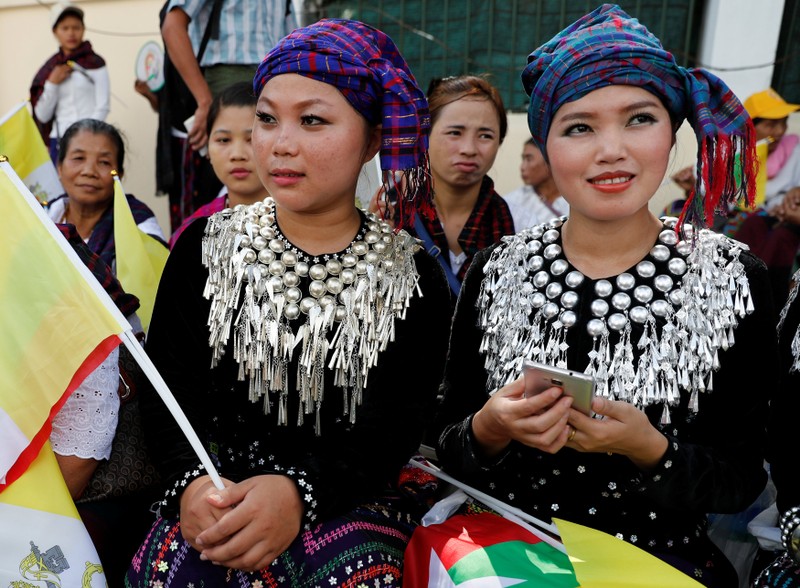Women from Kachin State wait outside the residence of Cardinal Charles Maung Bo, Archbishop of Yangon, where Pope Francis will be staying during his visit in Yangon