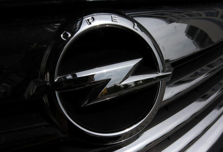 An Opel logo is pictured on a car in front of the Opel headquarters in Ruesselsheim