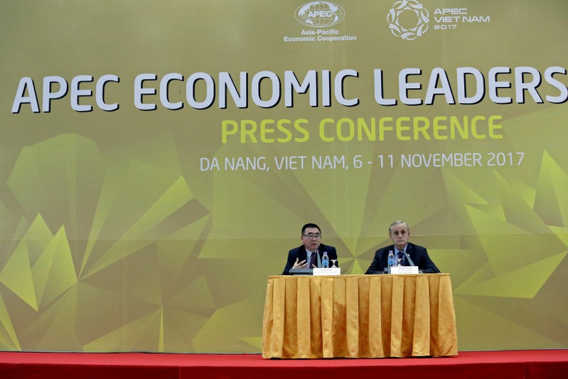 APEC Policy Support Unit Director Denis Hew and Executive Director of the APEC Secretariat Alan Bollard attend a press conference during 2017 APEC Summit Week in Da Nang