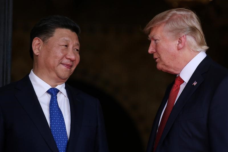 FILE PHOTO: U.S. President Donald Trump welcomes Chinese President Xi Jinping at Mar-a-Lago state in Palm Beach, Florida, U.S.