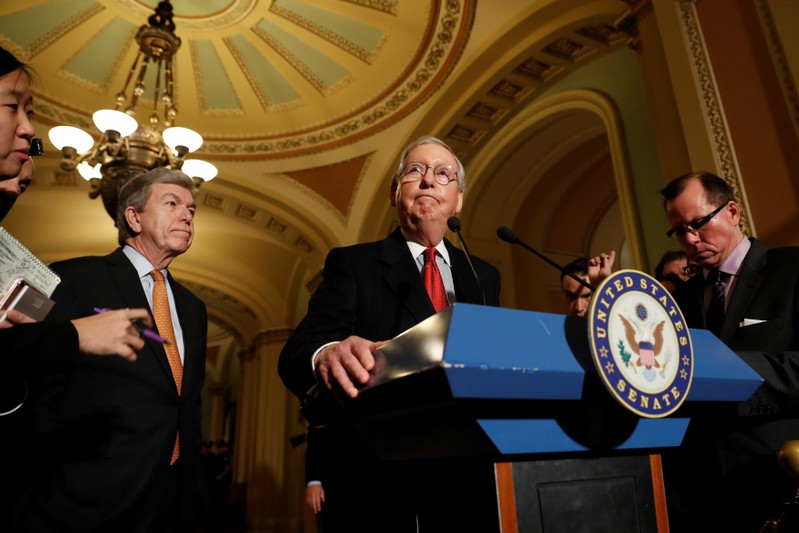 Senate Majority Leader Mitch McConnell, accompanied by Sen. Roy Blunt (R-MO), speaks with reporters following the party luncheons on Capitol Hill in Washington