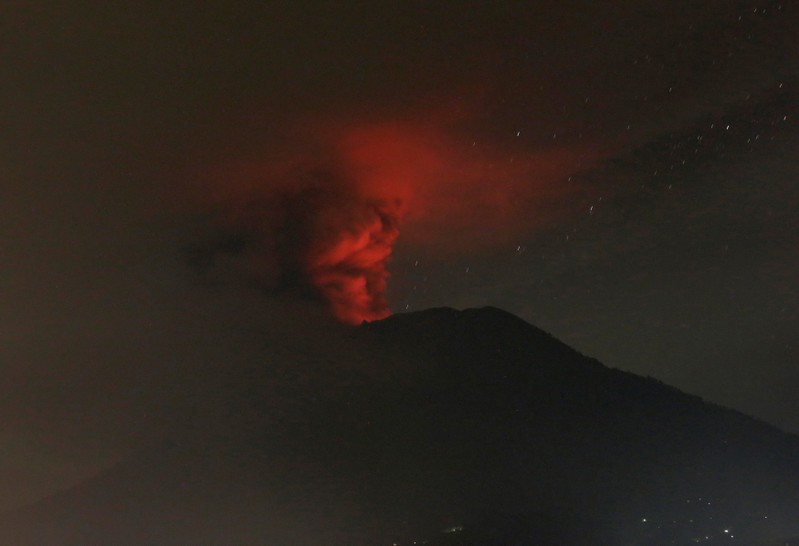 Mount Agung volcano is seen erupting from Glumpang village