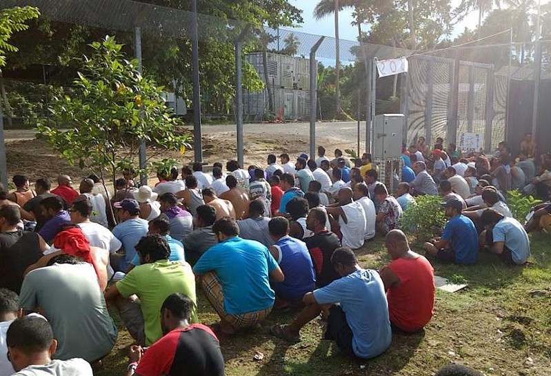 An undated image released shows detainees staging a silent protest inside the compound at the Manus Island detention centre in Papua New Guinea