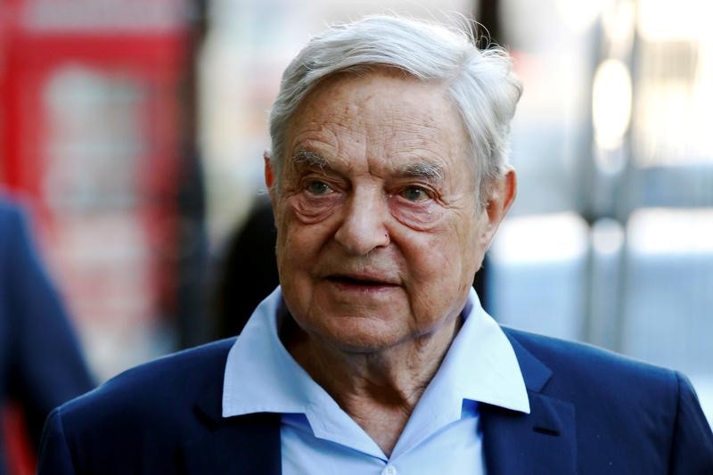 FILE PHOTO - Business magnate George Soros arrives to speak at the Open Russia Club in London
