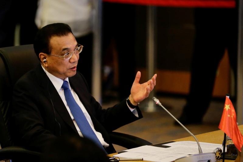 Chinese Premier Li Keqiang gestures during the 20th ASEAN China Summit in Manila