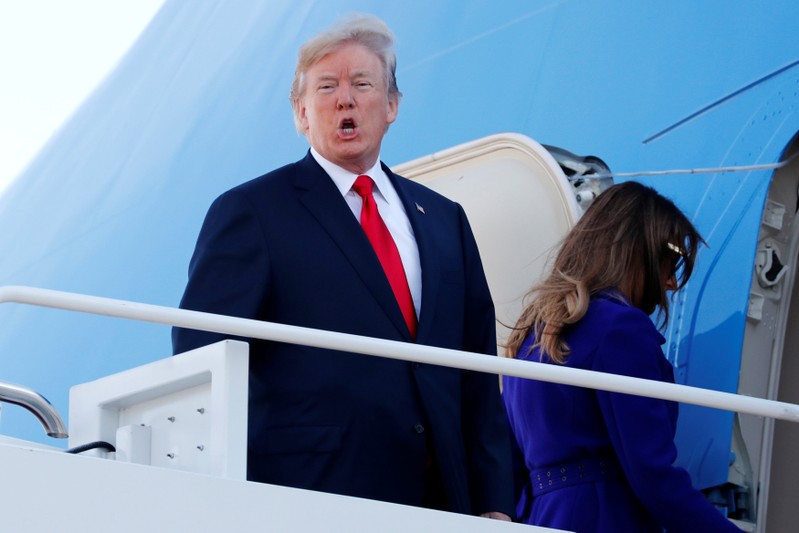 Trump and first lady Melania Trump arrive to board Air Force One for travel to Hawaii from Joint Base Andrews, Maryland