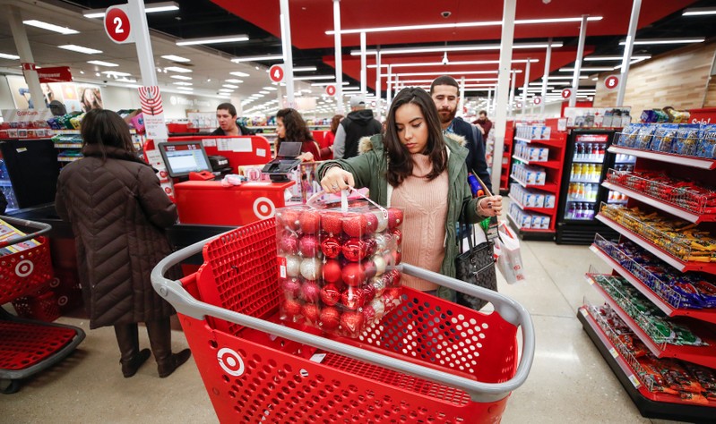 A customer loads her shopping cart during the Black Friday sales event on Thanksgiving Day at Target in Chicago