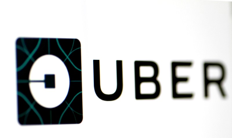 FILE PHOTO - The Uber logo is seen on a screen in Singapore