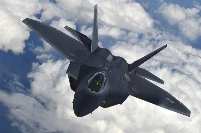 FILE PHOTO: A U.S. F-22 Raptor fighter flies over European airspace