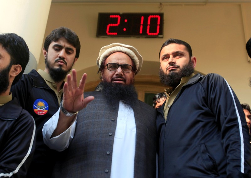 Hafiz Saeed speaks with supporters after attending Friday Prayers in Lahore