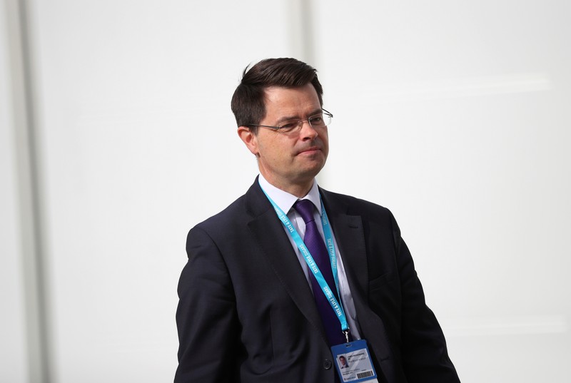 Britain's Northern Ireland Secretary James Brokenshire walks beween venues at the Conservative Party conference in Manchester