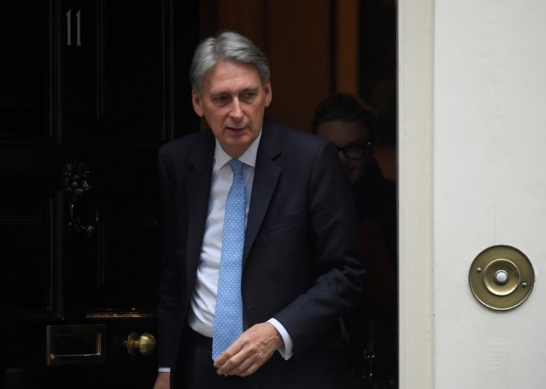 UK’s Hammond, under pressure on budget, promises more homes