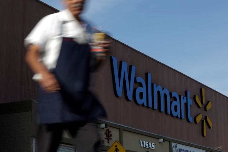 An employee walks out from a Walmart store in Monterrey